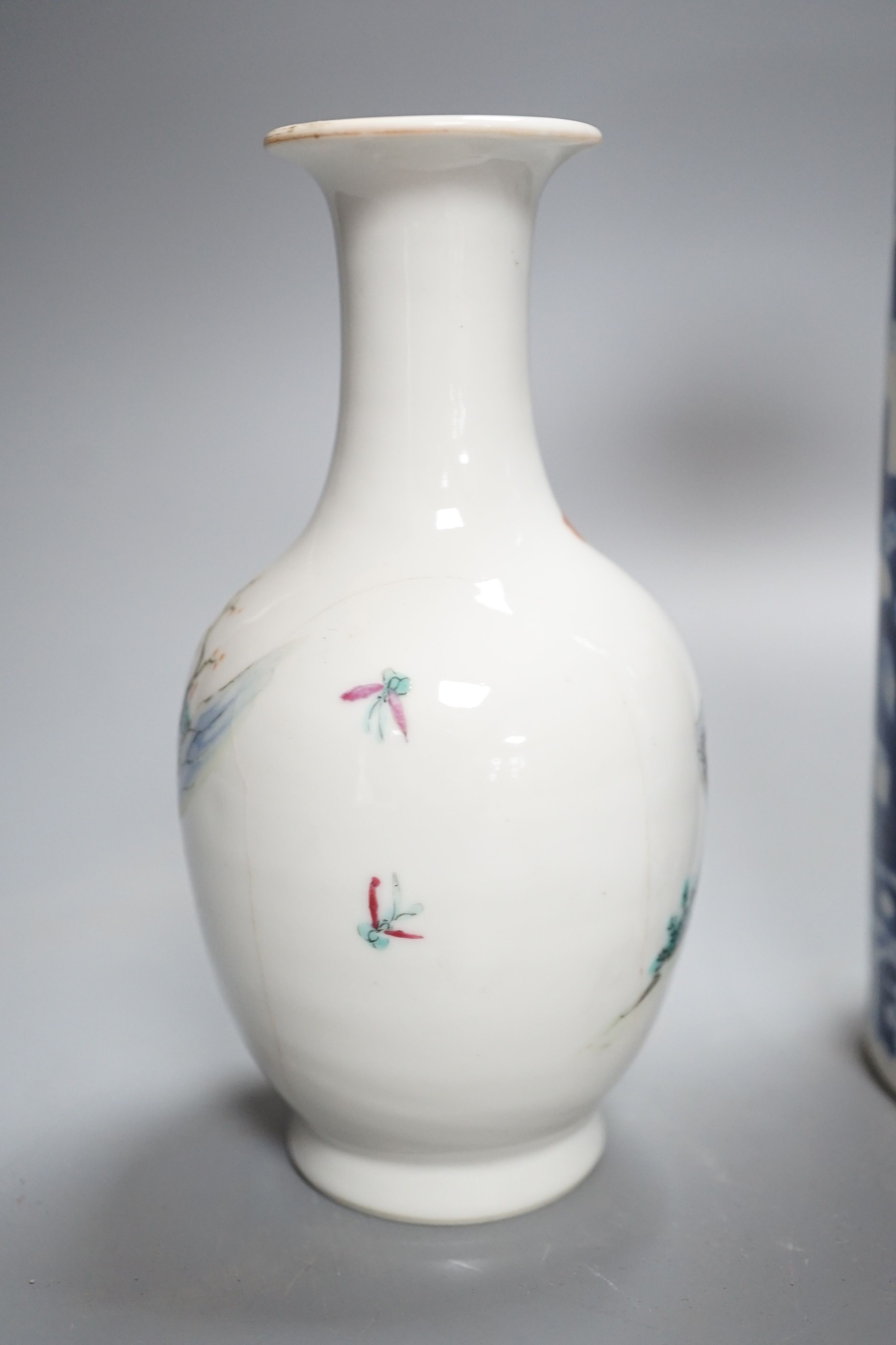 A Chinese blue and white sleeve vase and small famille rose vase, sleeve vase 25 cms high.